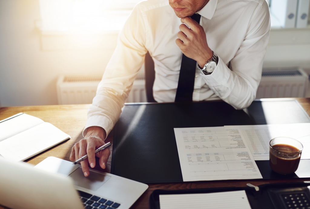 bigstock-Business-Man-Working-At-Office-106691141.jpg